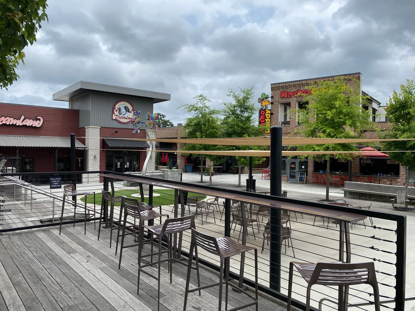 Brick storefronts and a planted courtyard in downtown Duluth